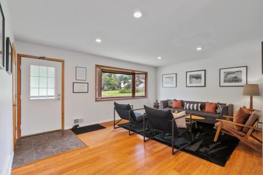 Large, bright living room with bamboo floors