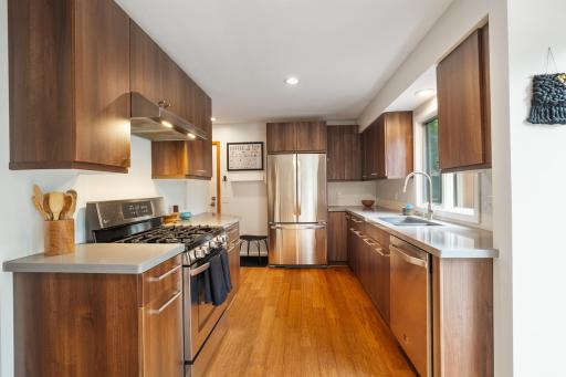 Renovated kitchen with stainless steel appliances.