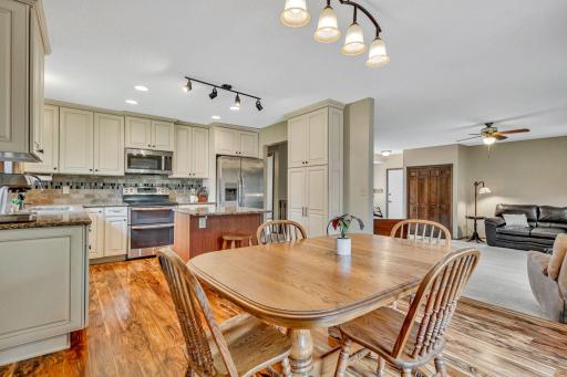Stainless appliances, tiled backsplash, built-in pantry.