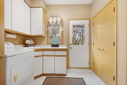 Main floor Laundry/mudroom right off the garage leading out to the side of the home.