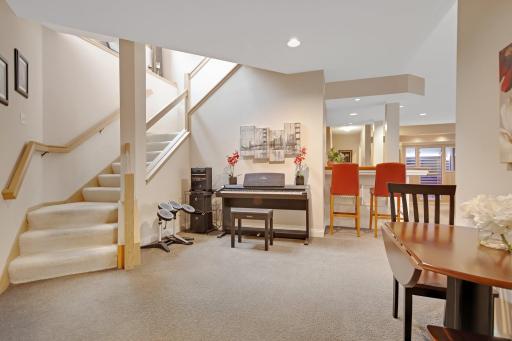 Lower Level has raised ceilings, a wet bar and a large TV/Home Theatre - the screen drops down from the ceiling - this will stay with the home. Also a $15K upgrade to access lower level from the garage.