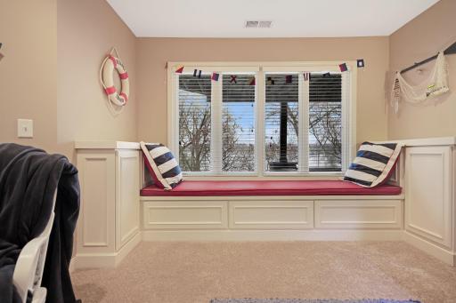 window seat has storage on the sides and below - custom woodwork throughout