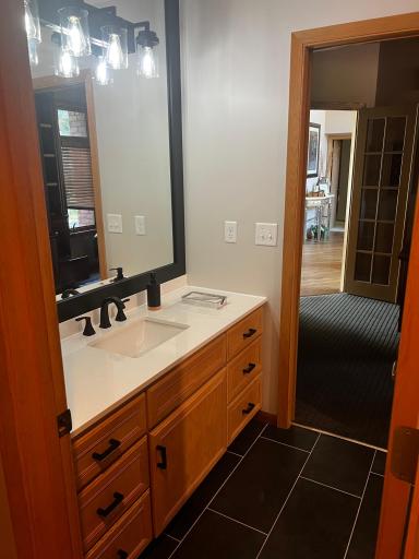 Main floor 3/4 bath - adjacent to the main floor study - recently remodeled - it's stunning!