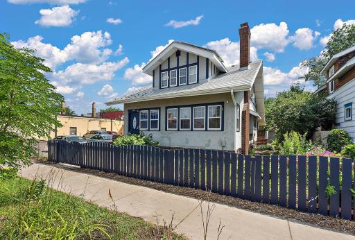 Welcome to 3011 17th Ave S! Fresh trim and fence paint, a long-lasting metal roof, and solar panels add to the 1917 facade