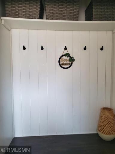 Welcome to 1217 68th Lane N! As you walk in the front door you'll be greeted with this custom built closet. You can leave you coats and shoes at the door. To your right is the garage entrance. Turn to your left to begin your tour!