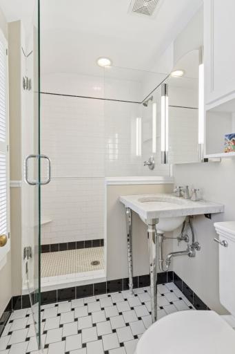 Remodeled 3/4 hall bath with tiled shower and vintage details