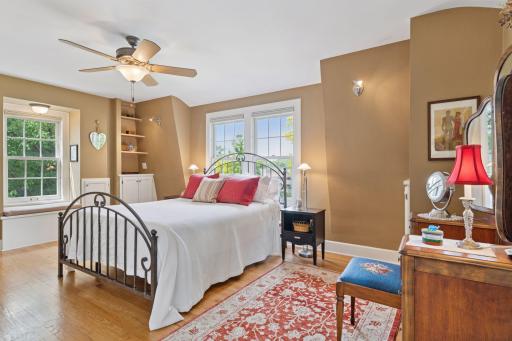 Upper-level primary bedroom with built-ins and character-filled design
