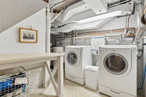Lower-level laundry room with clothes chute