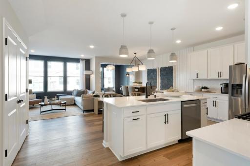 Wide open modern floorplan creates a memorable and striking home from any angle! Photo of model home.