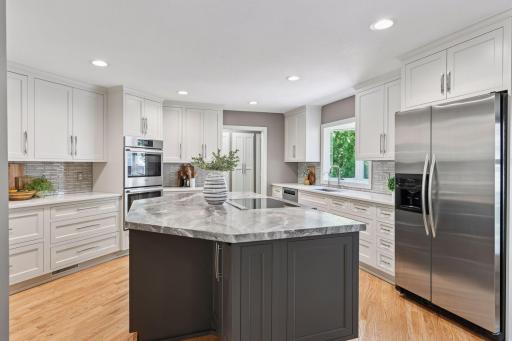 Absolutely stunning kitchen. Wolf Induction Cooktop, walk-in pantry, custom cabinets throughout with rollout shelving, and endless counter space.