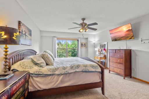 Primary bedroom with bath and walk-in closet