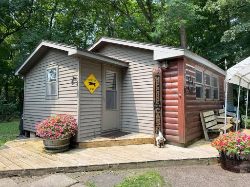 Cute as can be seasonal cabin getaway property on Hunters Point MilleLacs! Easy maintenance with mostly steel siding and an appealing "log cabin" front view!