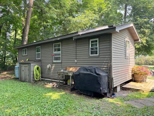 A shot of the cabin's exterior. The well house cubby is shown here at the rear of the cabin.
