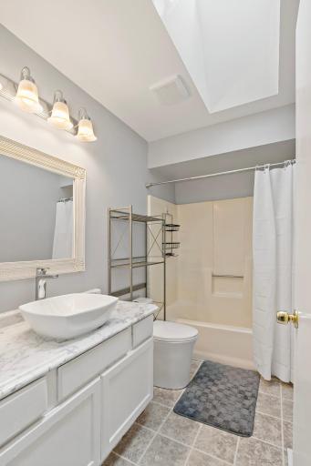 Updated full bath with new dual flush toilet.