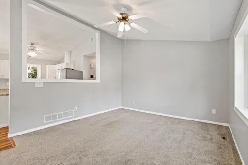 Living room with large pass through open to kitchen.