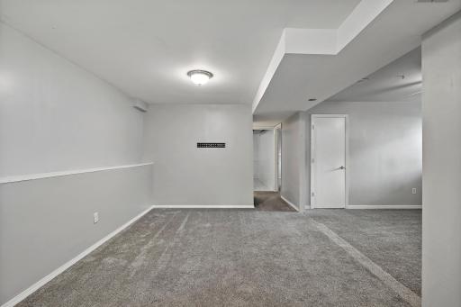 Lower level family room. Family room was expanded. Office area on the right was formerly 4th bedroom.