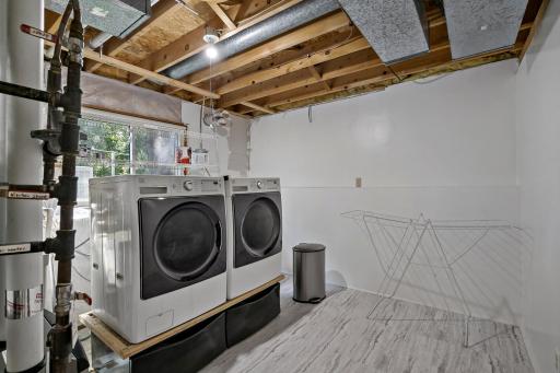 Laundry room with newer washer and dryer.