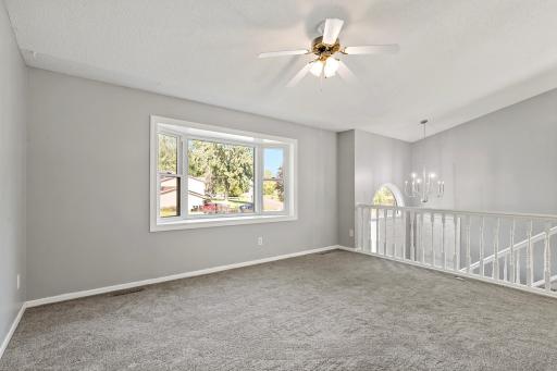 Light and bright living room with bow window.