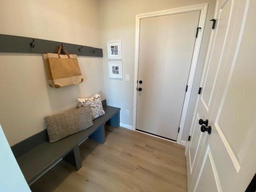 Large mudroom and built in bench. Photos taken from model of similar floor plan. Photos may not depict actual home plan configuration. Features/materials/finishes shown contain options that are not included in price.