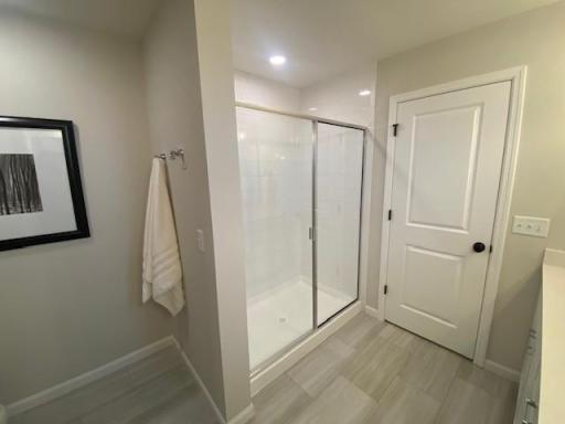 Primary bathroom with Large walk-in shower. Photos taken from model of similar floor plan. Photos may not depict actual home plan configuration. Features/materials/finishes shown contain options that are not included in price.
