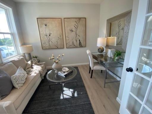 Main floor front office with French doors. Photos taken from model of similar floor plan. Photos may not depict actual home plan configuration. Features/materials/finishes shown contain options that are not included in price.