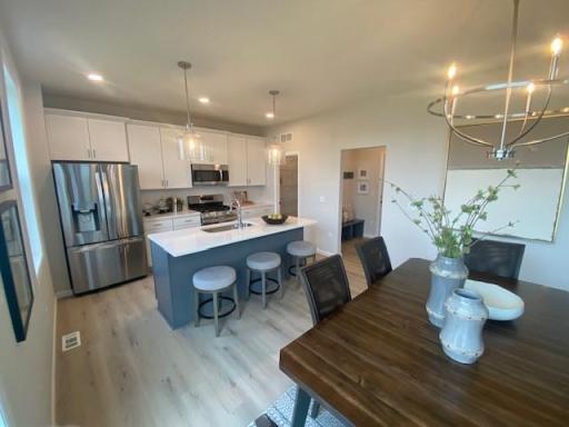 Virginia kitchen and large walk-in pantry. Still time to personalize!
Photos taken from model of similar floor plan. Photos may not depict actual home plan configuration. Features/materials/finishes shown contain options not included