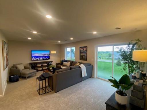 Finished lower level includes 5th bedroom & another bathrm, still time to personlize. Photos taken from model of similar floor plan. Photos may not depict actual home plan configuration. Features/materials/finishes shown contain options not included
