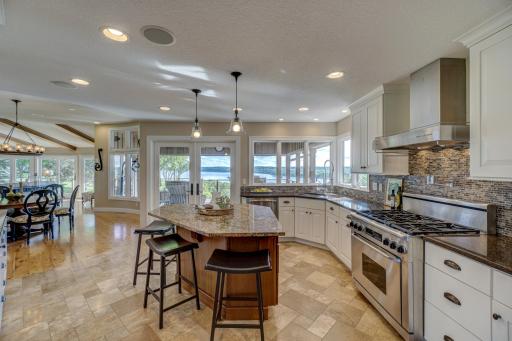 Step inside to a sunlit open layout adorned with elegant fixtures & finishes. The kitchen boasts SS appliances, granite counters, a center island, & walk-in pantry.