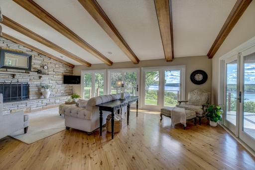 The living room shines with floor to ceiling windows & a cozy fireplace.