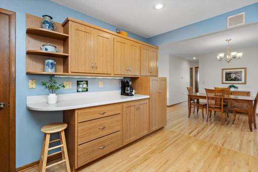Updated Kitchen has hard surface countertops, window for view of back yard and a Solar Tube for natural lighting