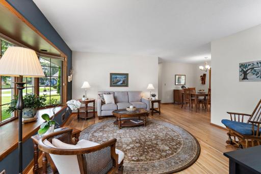Main Floor Living Room has bay windows and hardwood floors