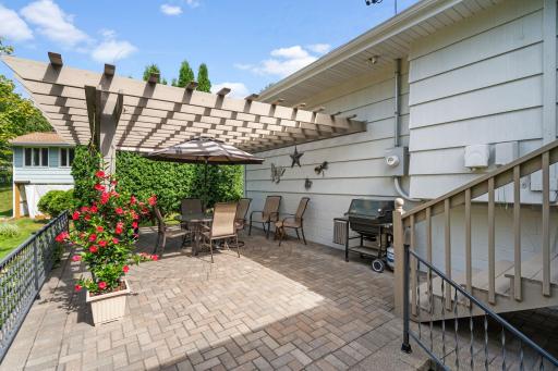 Upper Level Paver Patio with Trellis and stairs to access 4 season porch!