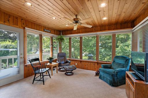 Step out from dining room to your beautiful 4-season porch with private views of back yard, deck, large patio and meticulously landscaped!