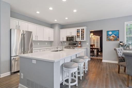 Fabulous kitchen with white cabinets and beautiful counters.
