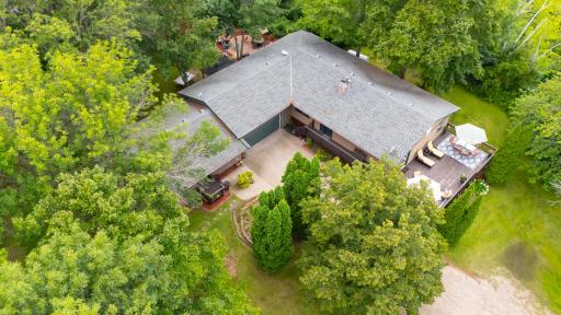 In this aerial view on the right is the home in the center is the 2 car attached garage and to the left of that is the mother-in-law apartment which has its own separate entrance. Perfect for a Home Office, rental or family member
