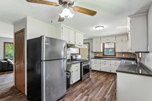 Well-designed kitchen offers ample storage and contemporary stainless steel appliances for everyday convenience.
