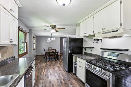 The kitchen connects naturally to the dining area, ideal for gatherings and family meals.