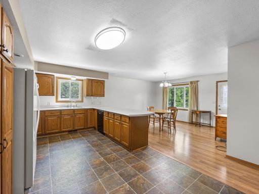 The kitchen features tons of natural woodwork.