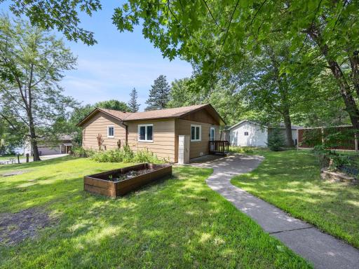 The landscaping has been well maintained and includes multiple different plantings.