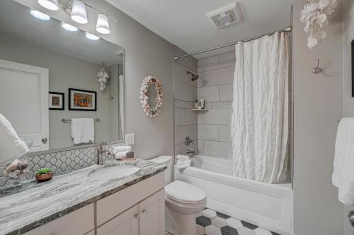 Beautifully updated full bathroom in the lower level with stylish, modern finishes!