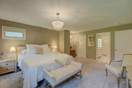Retreat to your spacious primary suite, complete with a beautifully updated private bath and a walk-in closet