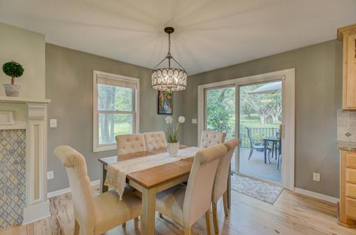 Enjoy the peaceful nature view from this informal dining room space with convenient walkout access to the expansive maintenance free deck