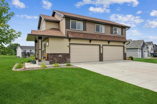 Who wouldn't LOVE a 4 car garage?!? Maint free exterior, gutters, and concrete drive, makes this one a true GEM!