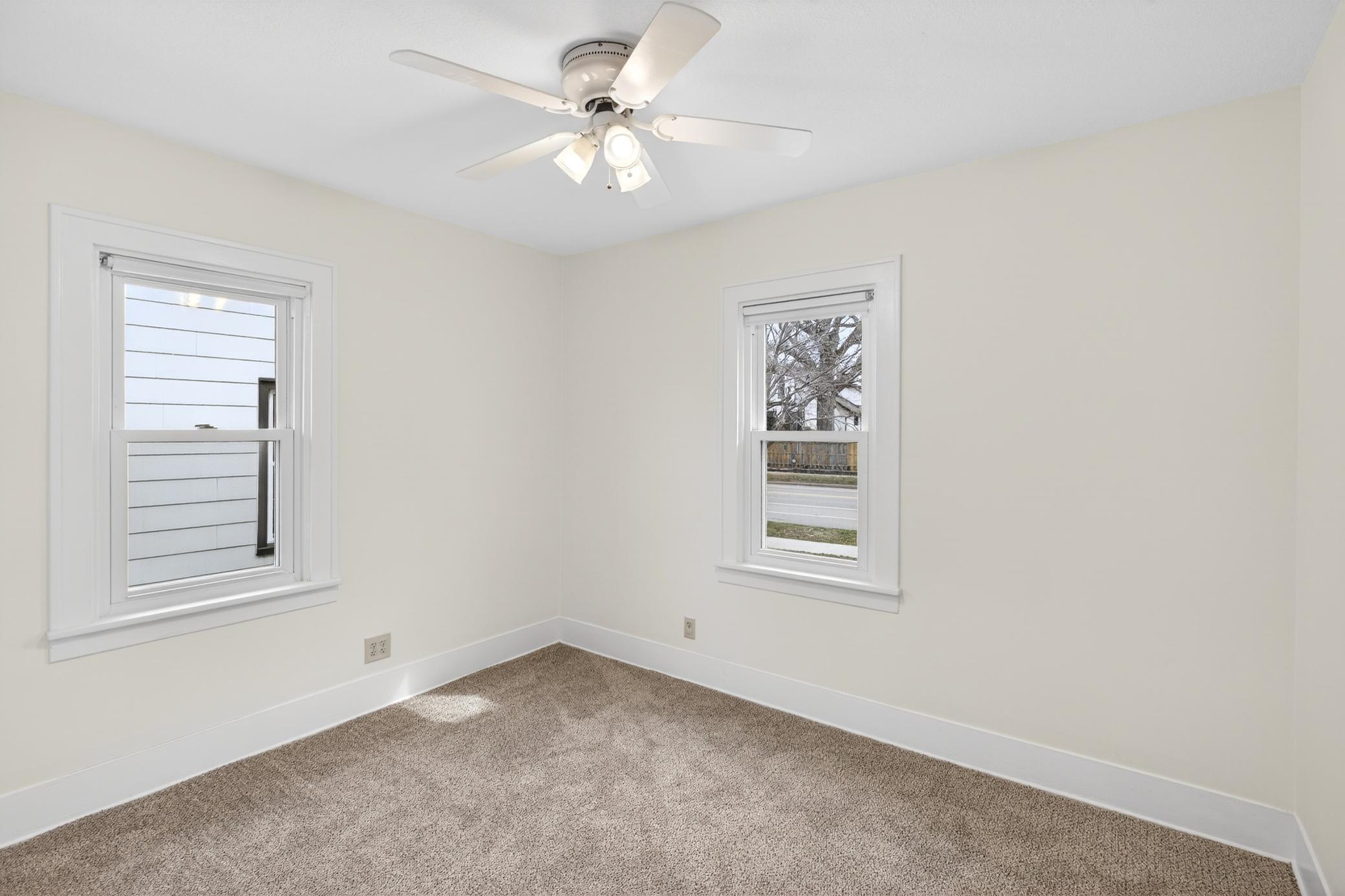 Bedroom #1 has fresh paint, new carpet, and lots of natural sunlight.