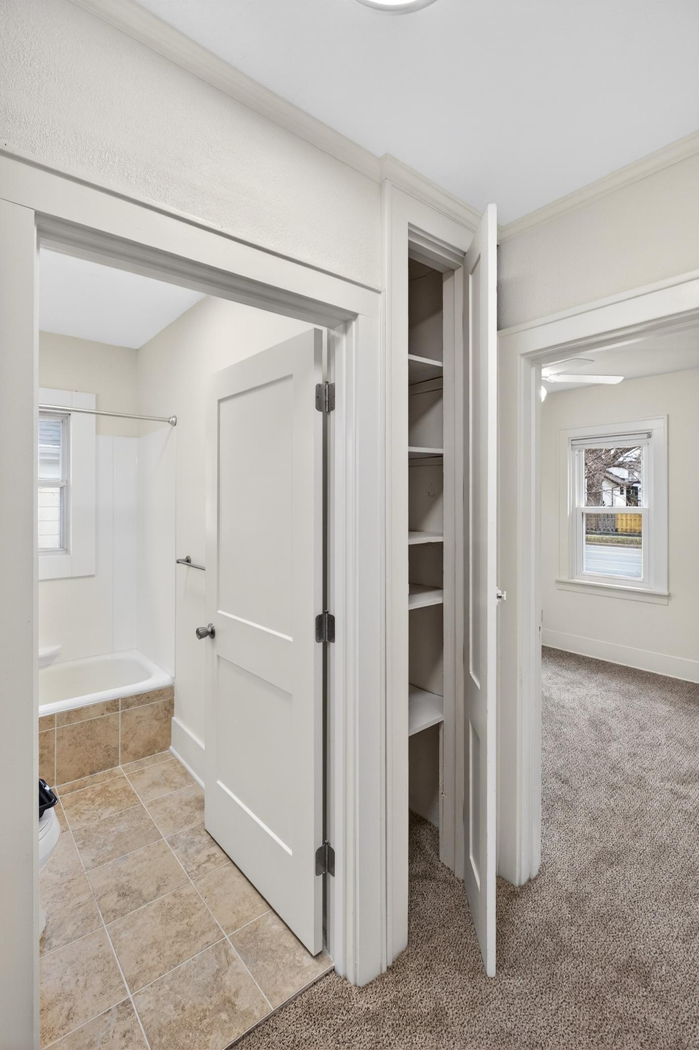Bathroom, linen closet and bedroom #1.