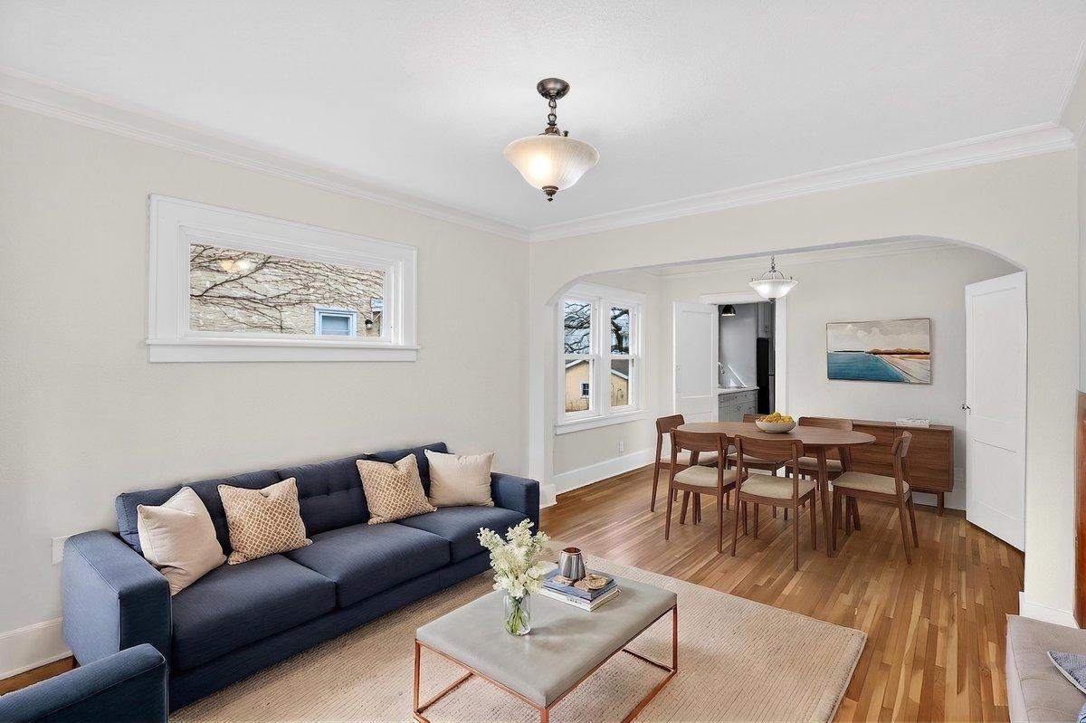 Digitally staged living room and dining room.