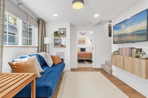 Living/Dining just past the kitchen with built ins and TV mount
