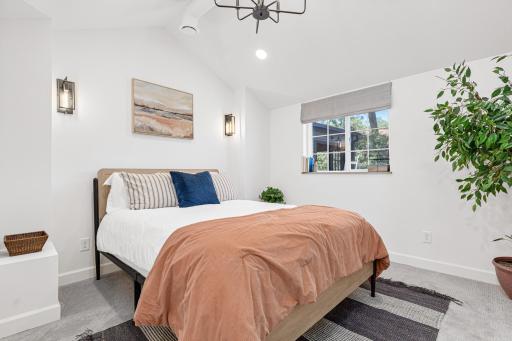 Main floor bedroom with vaulted ceiling - big enough for a King Bed with great lighting