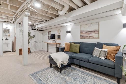 Lower Level has an electric fireplace and TV Mount + Auxiliary/Outlets on Wall
