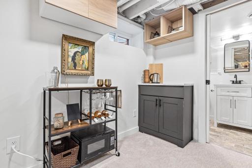 Built-ins in the lower level for a kitchenette, bar, or office with under the stairs closet